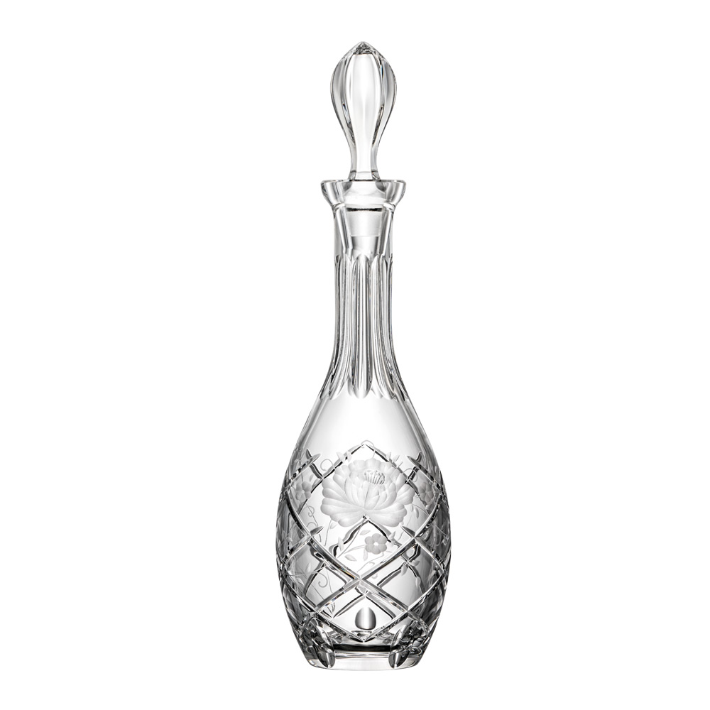 Tall, gleaming Sunrose crystal wine carafe with an elegant, long neck and bulbous body. Precise diamond patterns at the base, a central matt floral engraving surrounded by smaller blossoms. Matching stopper.